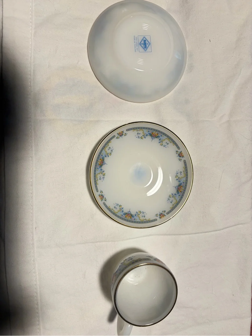 Porcelain Teacup and Saucer Set in White with Blue Floral Trim